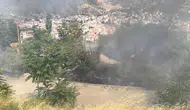 Tokat'ta otluk alanda çıkan yangın metruk binaya sıçradı