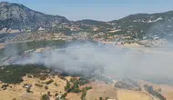 Kaş'ta ormanlık alanda çıkan yangına havadan ve karadan müdahale