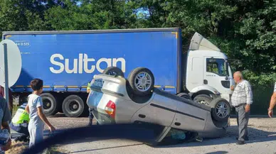Bursa'da kamyonla çarpışan otomobil takla attı