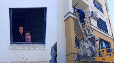 Evde mahsur kalan bebeği iş makinesi operatörü kurtardı!