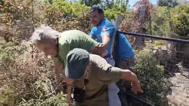 Kendini yakmak isteyen kadın, alevlerin arasından kurtarıldı