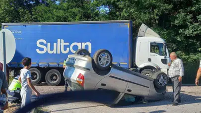 Bursa'da kamyonla çarpışan otomobil takla attı