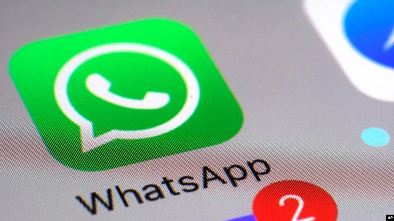 FILE - The WhatsApp communications app is seen on a smartphone in New York, March 10, 2017. Iran's top council responsible for safeguarding the internet voted Tuesday to lift a ban on the popular messaging application.
