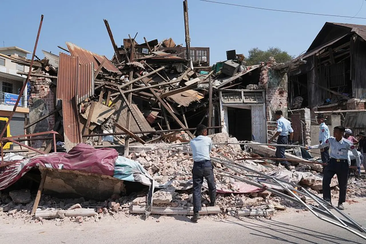 Military rescuers work through rubble of a collapsed building following an earthquake in Naypyidaw, 1 April, 2025
